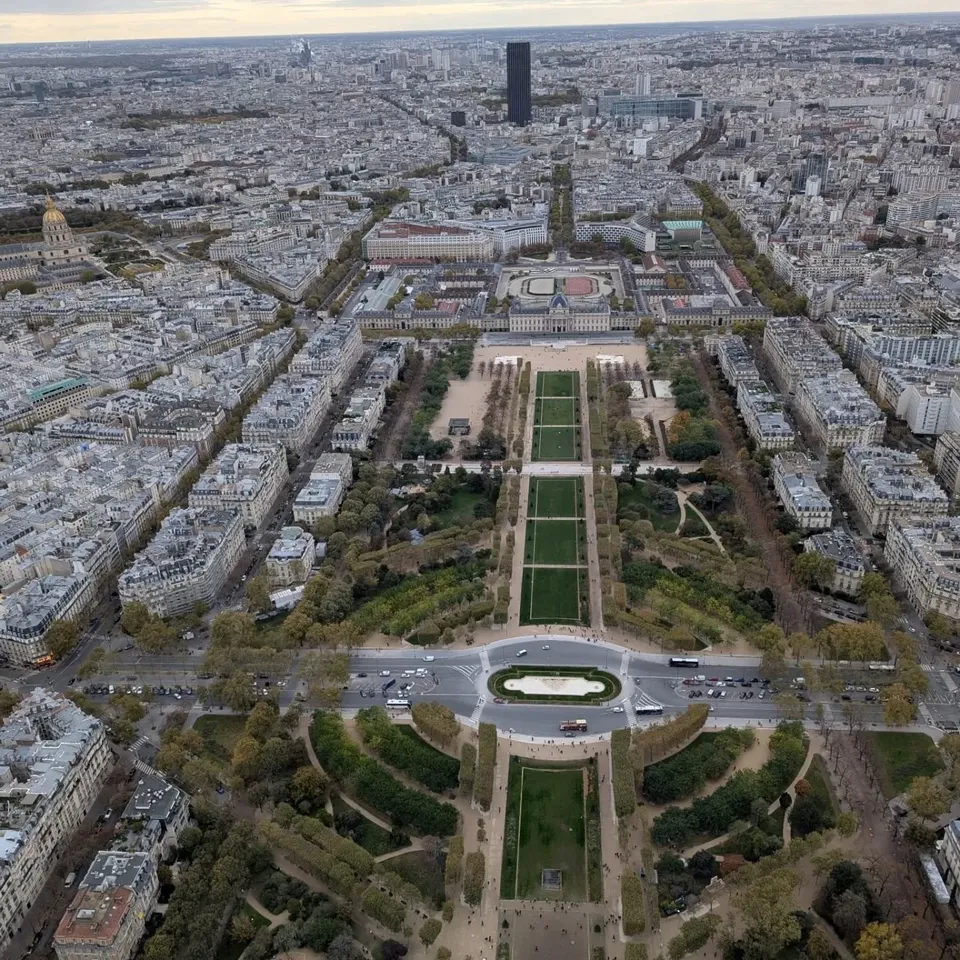 The Champ de Mars and Paris spread out below the Eiffel Tower